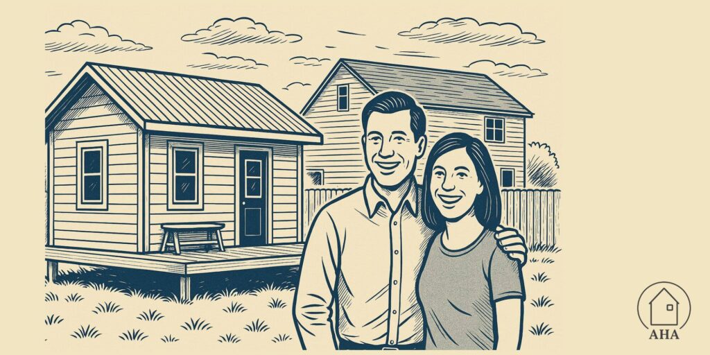 Man and woman standing  outside of a tiny home on foundations in a backyard.