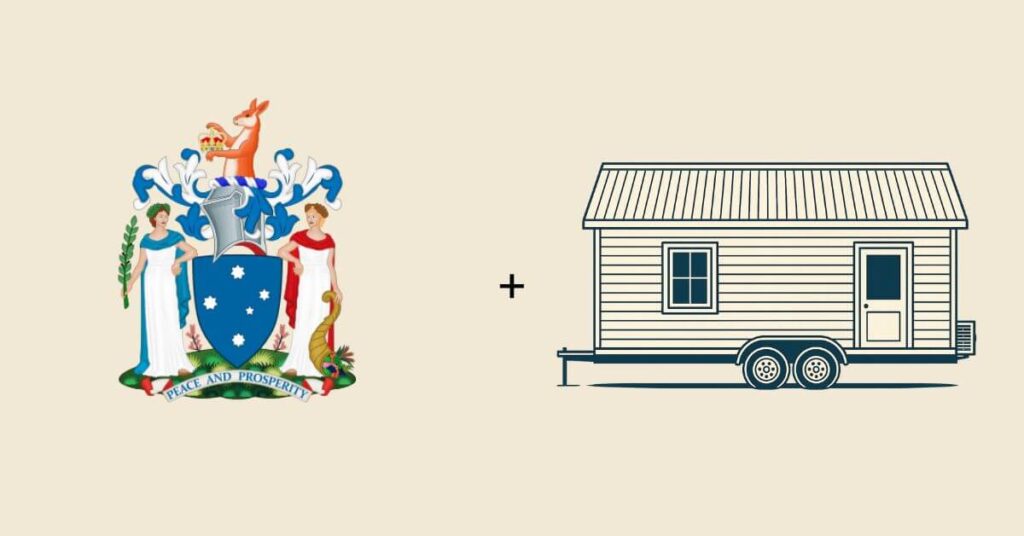 The coat of arms of the state of Victoria in Australia, beside a tiny home on wheels