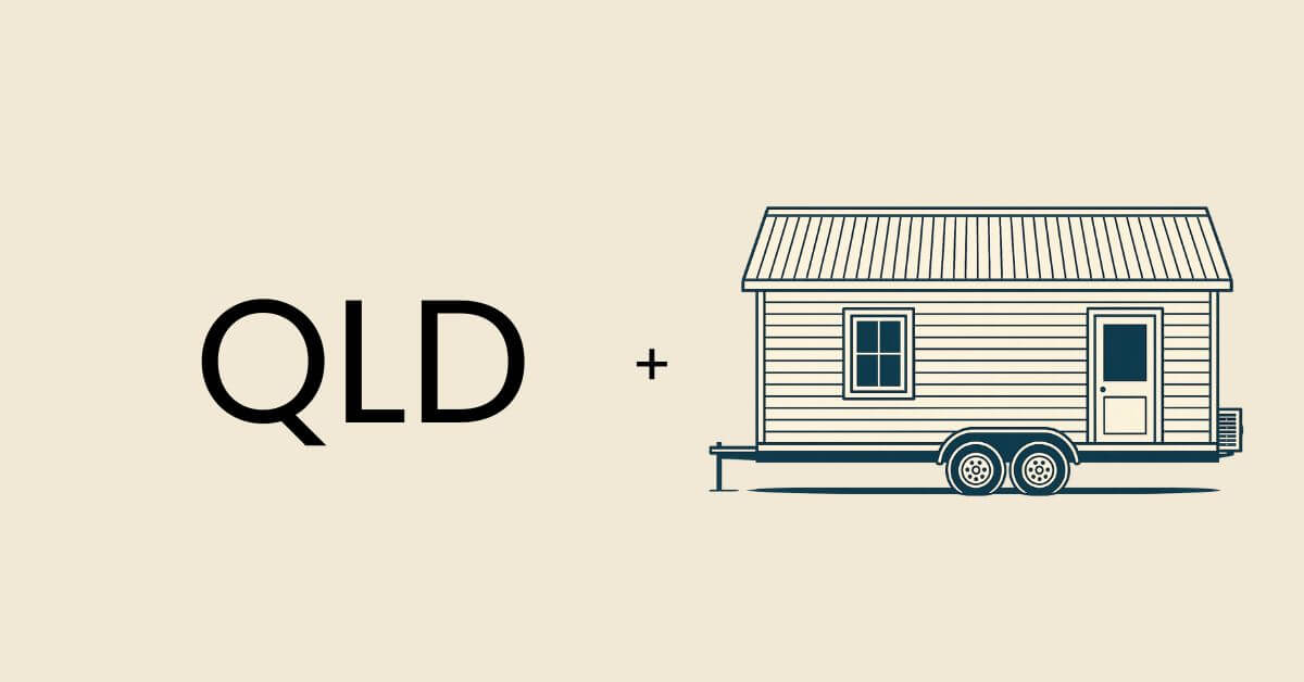 The term QLD positioned next to a tiny home on wheels.