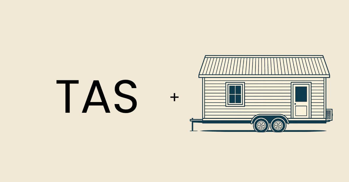 The acronym TAS representing Tasmania next to a graphic of a tiny home on wheels.